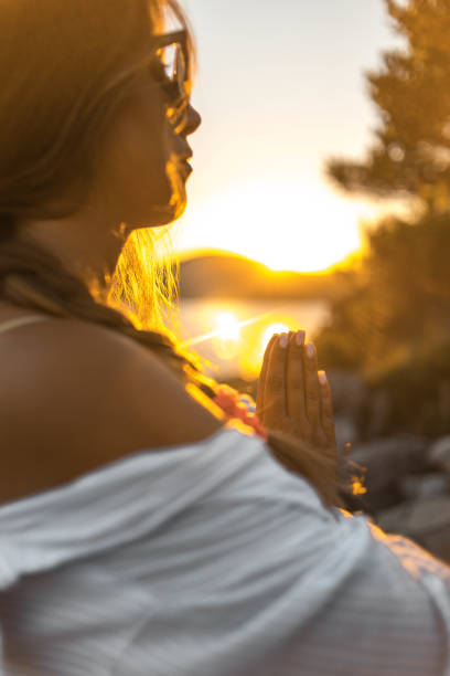 istock Young woman practicing yoga on the beach 1343770964
