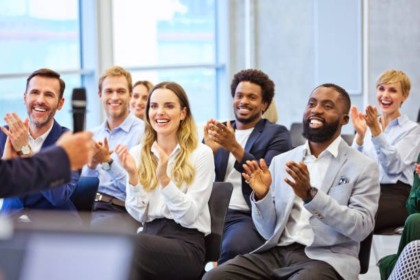 istock Cheerful audience during business seminar 1343772780