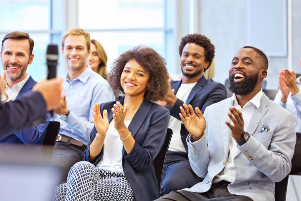 istock Cheerful audience during business seminar 1343772840
