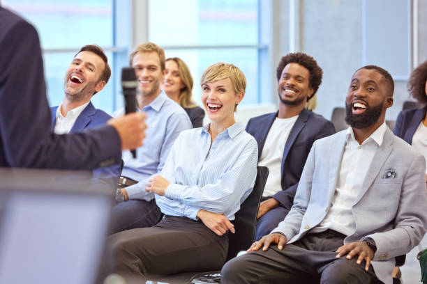 istock Smiling audience during business seminar 1343773077