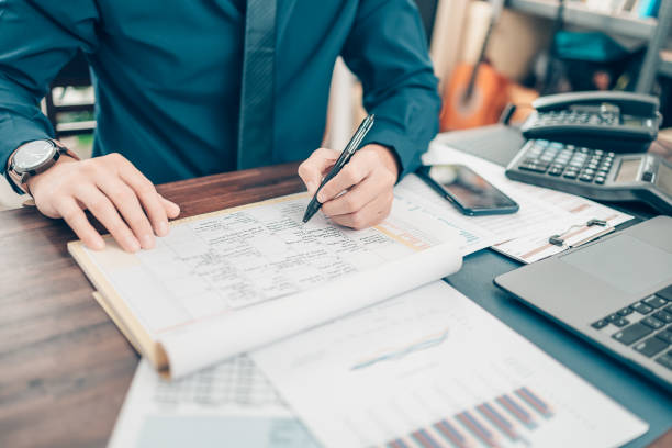 istock A man hand planning daily appointment and note at office desk. Planner plan Schedule Calendar and reminder. Business planning appointment concept. 1343775470