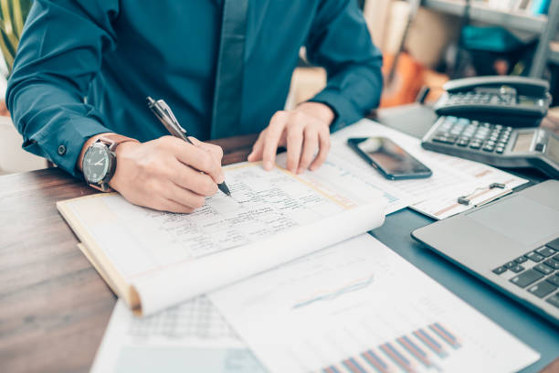 istock A man hand planning daily appointment and note at office desk. Planner plan Schedule Calendar and reminder. Business planning appointment concept. 1343776104