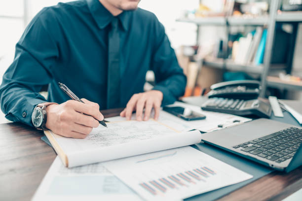 istock A man hand planning daily appointment and note at office desk. Planner plan Schedule Calendar and reminder. Business planning appointment concept. 1343776961