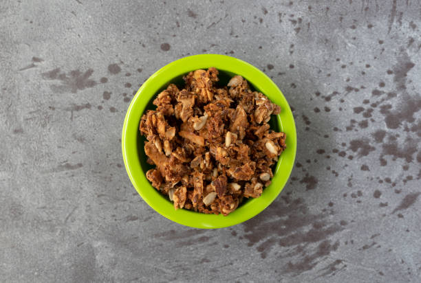 istock Bowl of cinnamon maple granola top view 1343778101