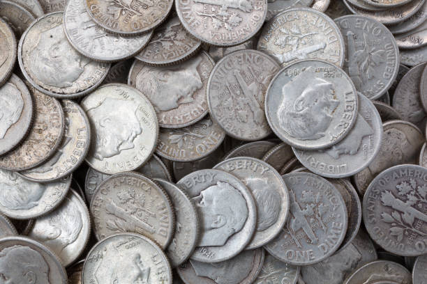 istock Very close view of old silver dimes illuminated with natural light. 1343778203