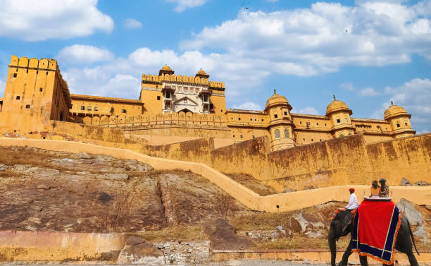 Amer Fort at Jaipur Rajasthan with view of tourists on elephant back stock photo