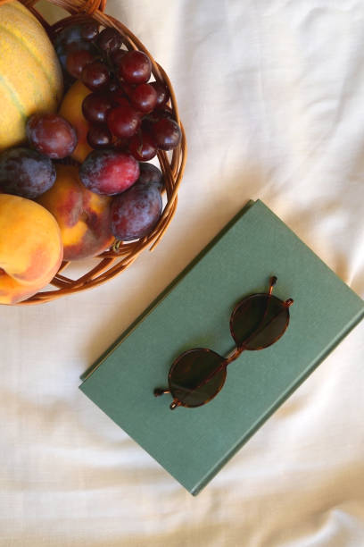 istock Picnic Basket, Book and Sunglasses 1343782565