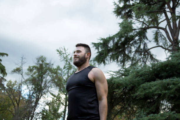 istock Young caucasian man with a beard practicing sport outdoors on a cloudy day 1343783110