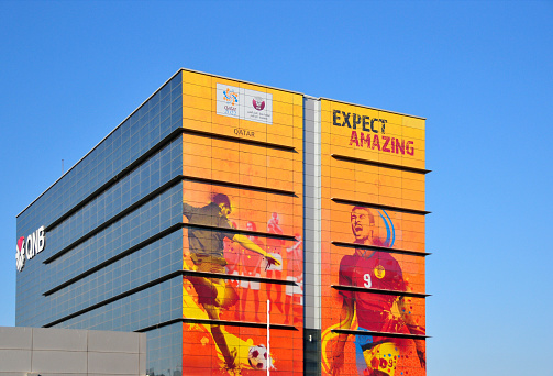 Doha, Qatar: Qatar National Bank QNB offices - architect Marwan Zgheib - Qatar soccer world cup decoration (2022 FIFA World Cup) - facade on Abdullah Bin Jassim Street