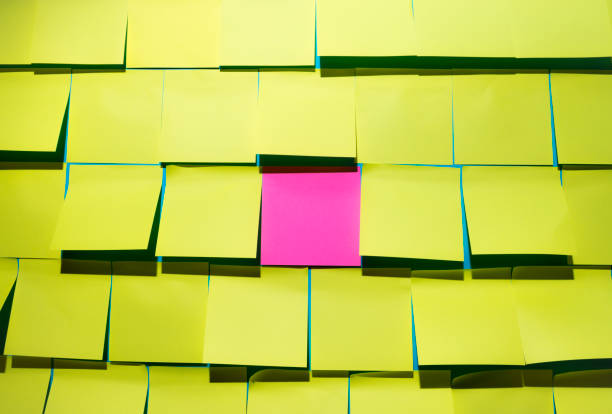 istock Creative layout made of yellow sticker notes with one pink note in a middle 1343790998