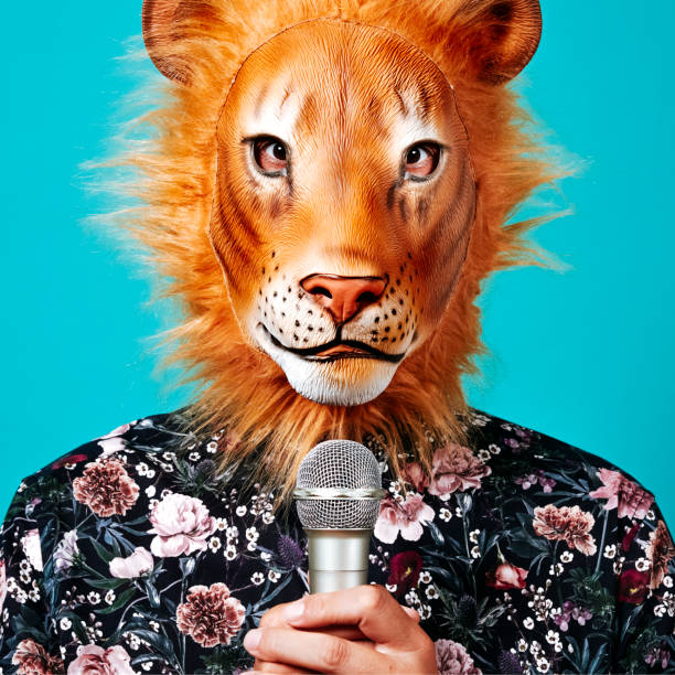 istock man with a lion mask holding a microphone 1343792220