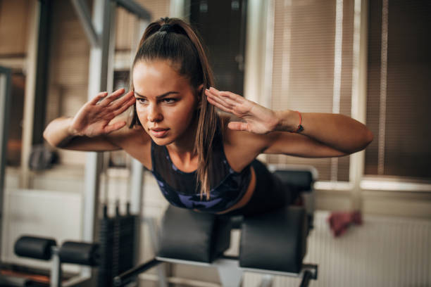 istock Woman exercising in gym 1343798845