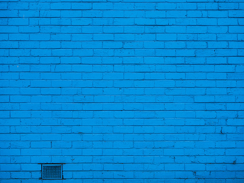 Petrol color old brick wall wide texture. Dark teal blue brickwork panoramic background