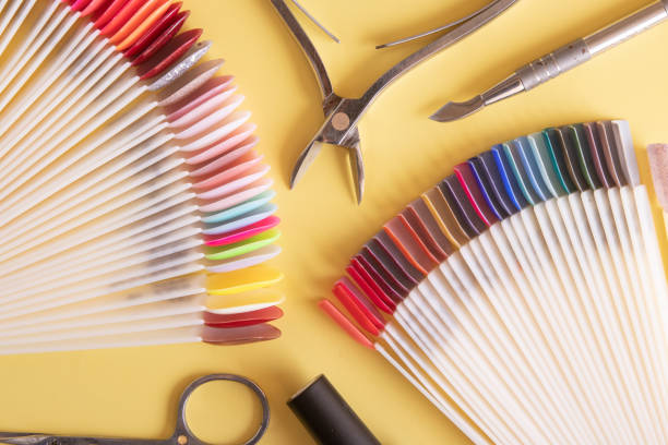 istock Tools for manicure flat lay on a colored background. Covering nails with gel polish concept 1343799375