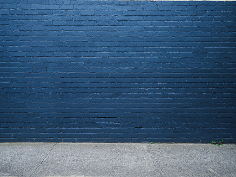Dark grunge blue brick wall