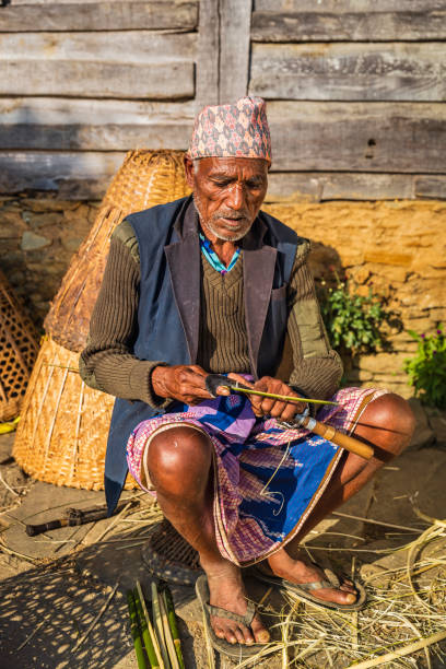istock Nepali man making a basket near Annapurna Range 1343800753