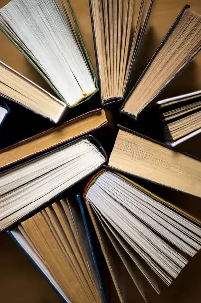 Photo of Open books - close-up. Books in the library. Top view of the pages.