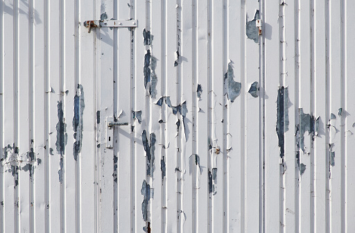 High resolution photograph of metal panels as a sheeting of an old industrial unit.