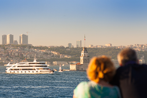 Istanbul, Turkey; May 24th 2013: Middle-aged couple looking at the Maiden's Tower.