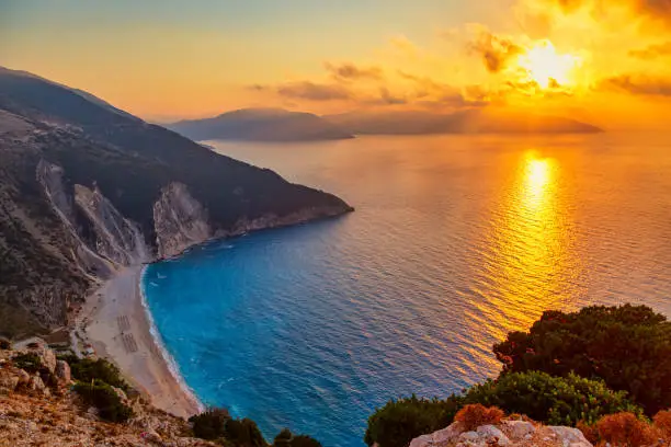 Beautiful colorful sunset at famous Myrtos beach on Kefalonia Isoland. Ionian sea, Greece.