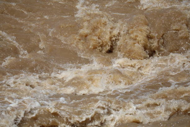 istock River flooding after heavy rain at Thailand 1343808535