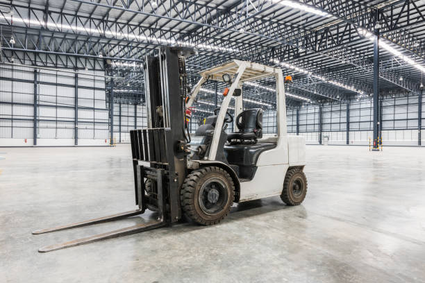 forklift in a modern warehouse stock photo