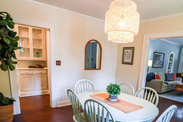 istock A small dining room with a statement rattan lighting ficture and a painted blue dining room table 1343810913