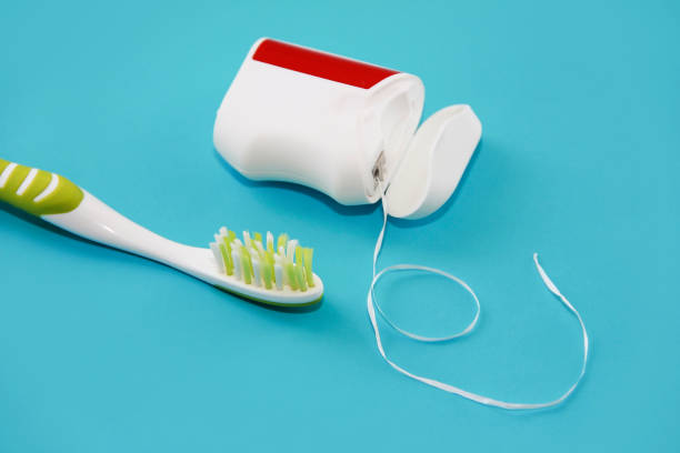istock red toothbrush and dental floss for brushing teeth 1343813332
