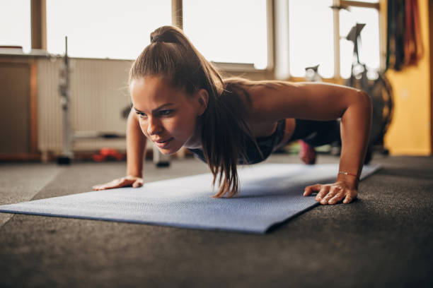 istock Beautiful woman doing push-ups 1343815477