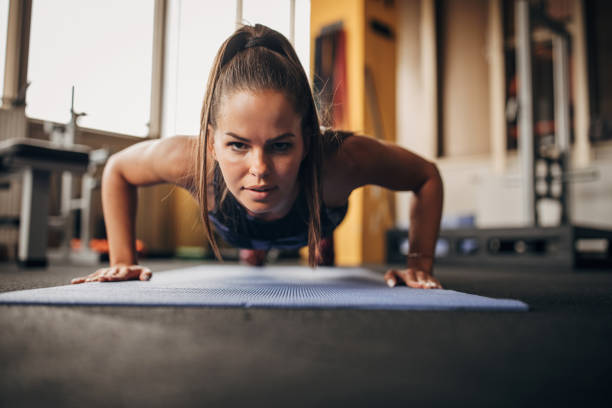 istock Beautiful woman doing push-ups 1343816200