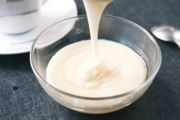 istock condensed milk in a bowl close up, 1343818390