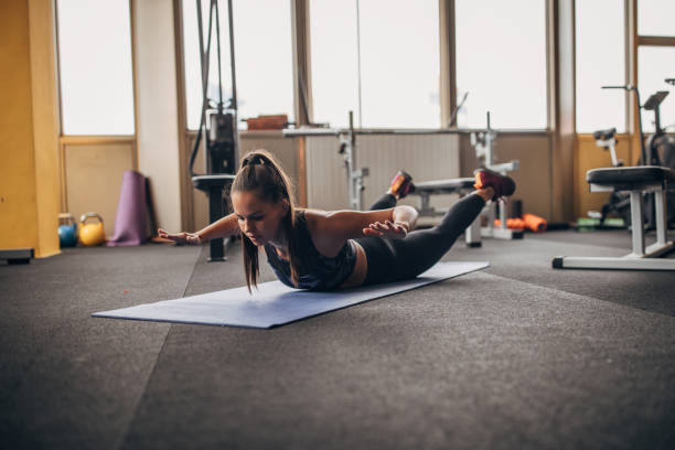 istock Fit woman exercising in gym 1343818725