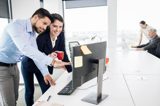 istock Businessman working on a project with his female colleague 1343824377