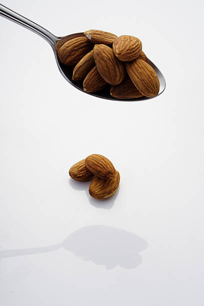 Almonds On A Spoon stock photo