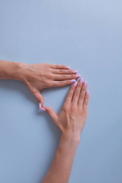 istock Two beautiful woman's hands with manicure isolated on white background. Place for text. 1343828894