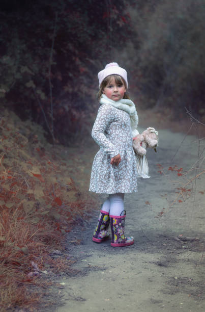 istock Little girl and teddy bear 1343830461