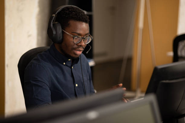 istock Young African American man working as a customer service employee 1343831741