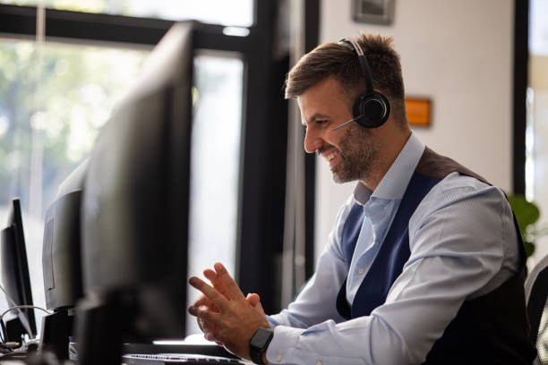 istock Side view of a happy Caucasian man working as a customer service employee 1343831920