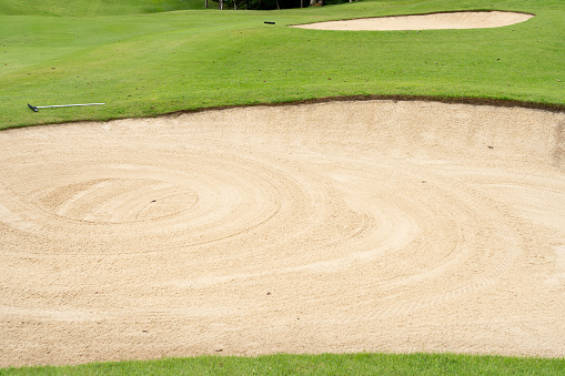 The sandpit in the golf course has been smoothed out