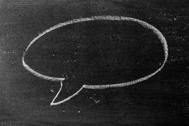 istock White color chalk hand drawing in round bubble speech shape with blank space on blackboard or chalkboard background 1343834902