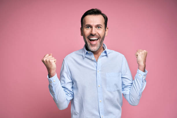 istock Studio shot of successful middle aged man celebrating achievement 1343835229
