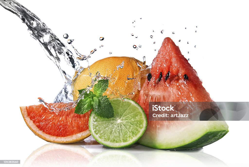 Water splash with fresh fruits isolated on white fruits with water splash Citrus Fruit Stock Photo