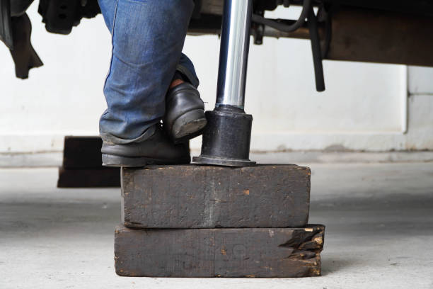 istock Worker standing on dirty old wooden block 1343837823
