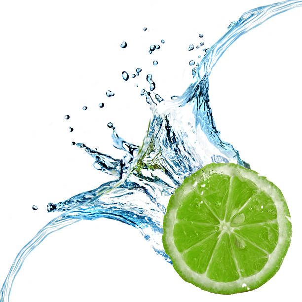 istock Fresh lime dropped into water with splash isolated on white 134383833