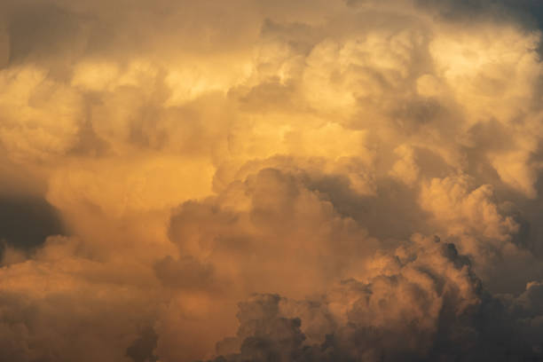 istock orange sunset clouds seen from the plane flying in a storm over Spain 1343839183