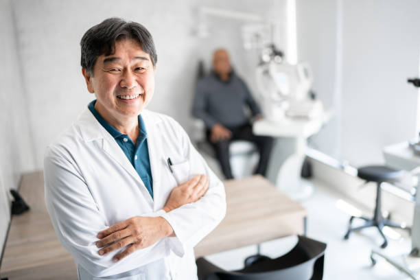 Portrait of a ophthalmologist in a medical clinic Portrait of a ophthalmologist in a medical clinic eye care professional stock pictures, royalty-free photos & images