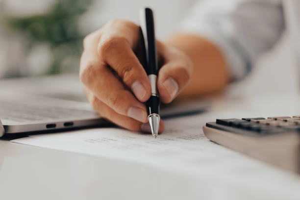 istock Businessman analyzing investment with laptop and calculator. Accounting concept 1343841005