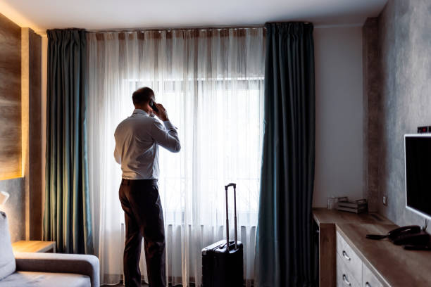 istock Businessman standing hotel suite and having a business talk 1343841167