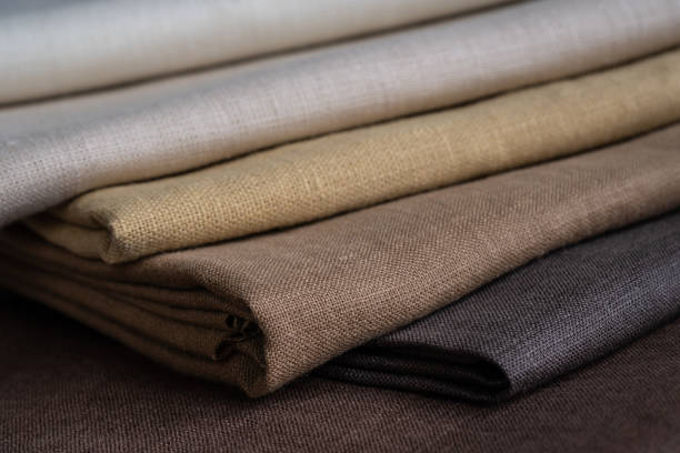 istock Stack of brown linen fabrics, close up 1343844221