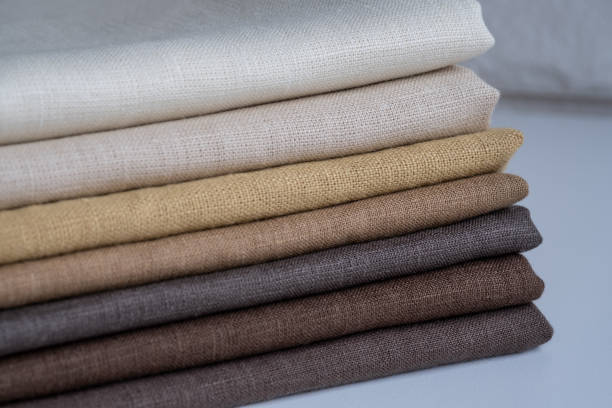 istock Stack of brown linen fabrics, close up 1343844223